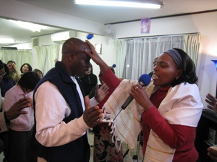 Apostle Carol praying for the anointing of the Holy Spirit