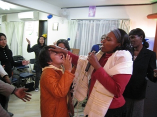 Apostle Carol praying for the anointing of the Holy Spirit