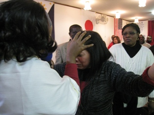 Apostle Carol praying for the anointing of the Holy Spirit